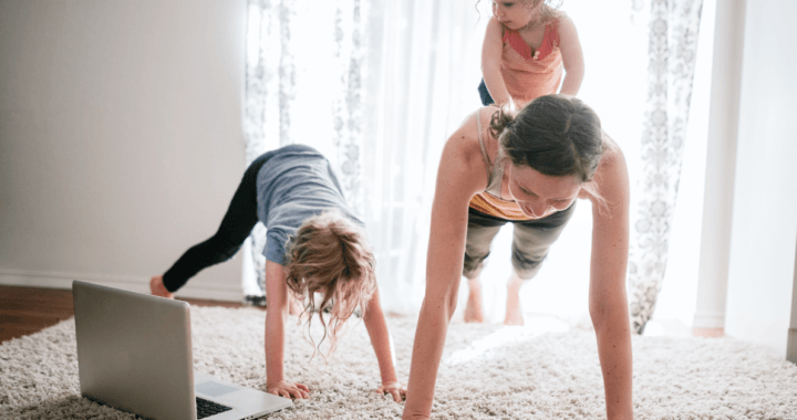 female working out at home with kids