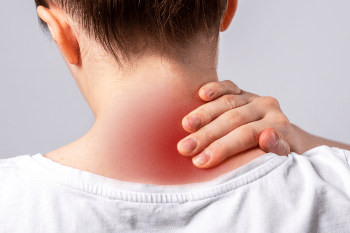 female massaging neck pain