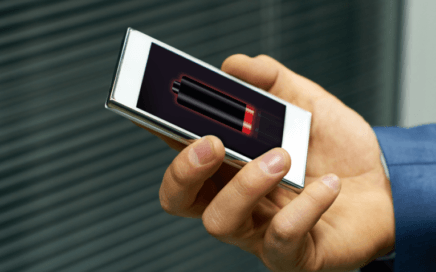 Modern Qi2/MagSafe wireless charging station with phone, watch, and earbuds on a sleek nightstand, hero banner for “Must-Have Wireless Charging Stations (2025)”.